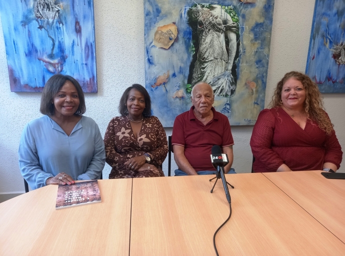 Departamento Arubiano/Caribiana di Biblioteca Nacional a ricibi buki 'E Cilinder Magico entre Aruba y Curaçao'