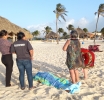 Turista Colombiano a fayece di atake di curazon pa beach di Arashi