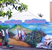 Artista Elvis Tromp ta renobando famoso mural na San Nicolas dedica na turismo